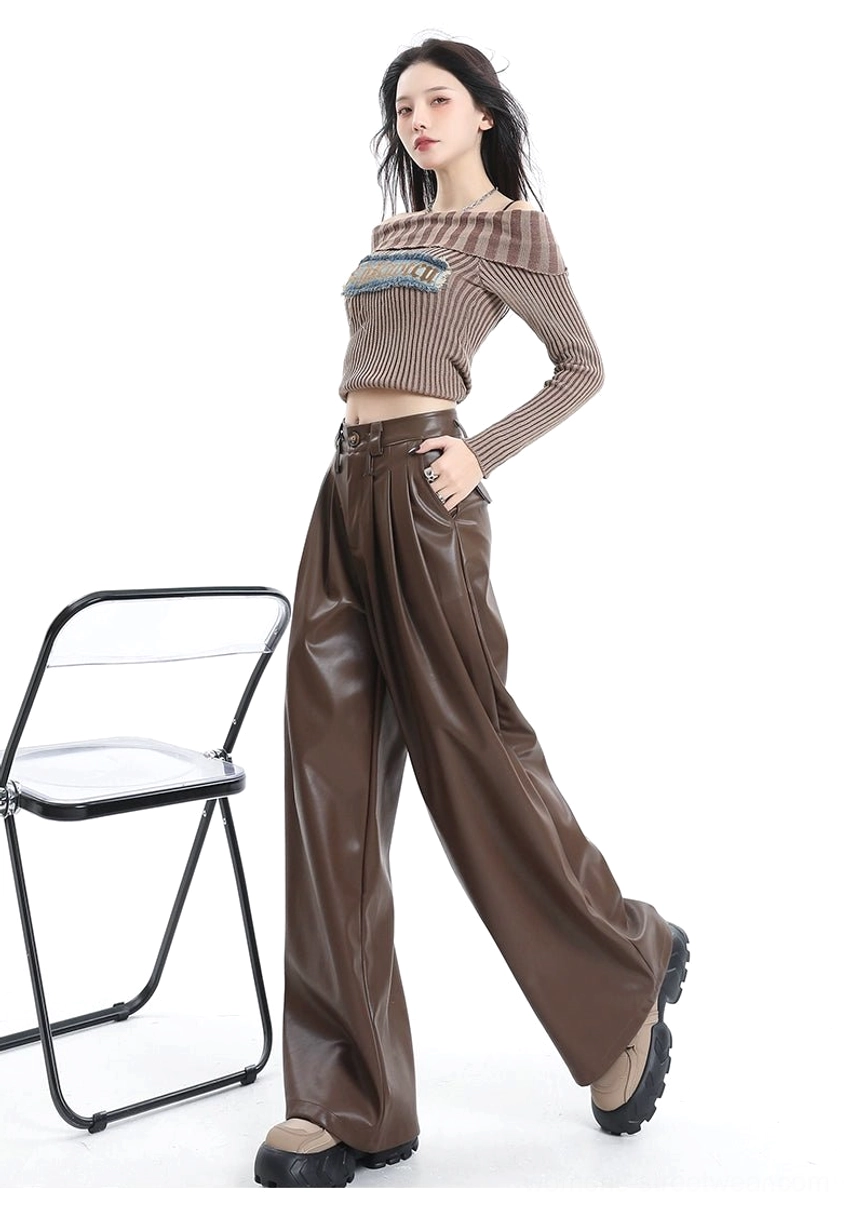 Three-quarter view of coffee brown tailored high-waisted PU leather pants with loose wide-leg fit and streetwear styling