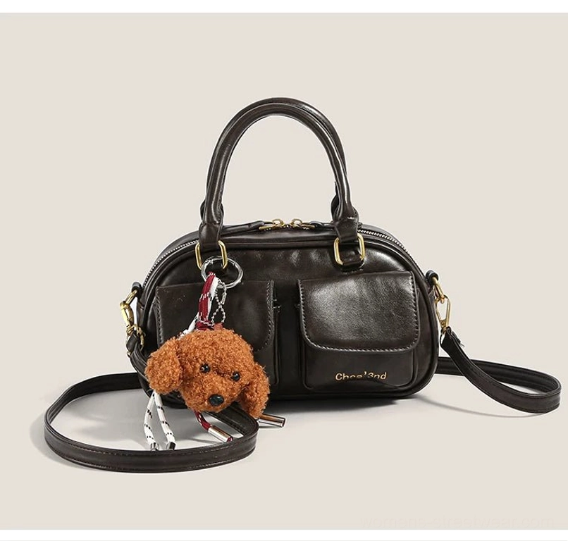 Coffee brown vintage puppy charm pocket bowling crossbody bag with gold-tone hardware detachable strap and front pockets