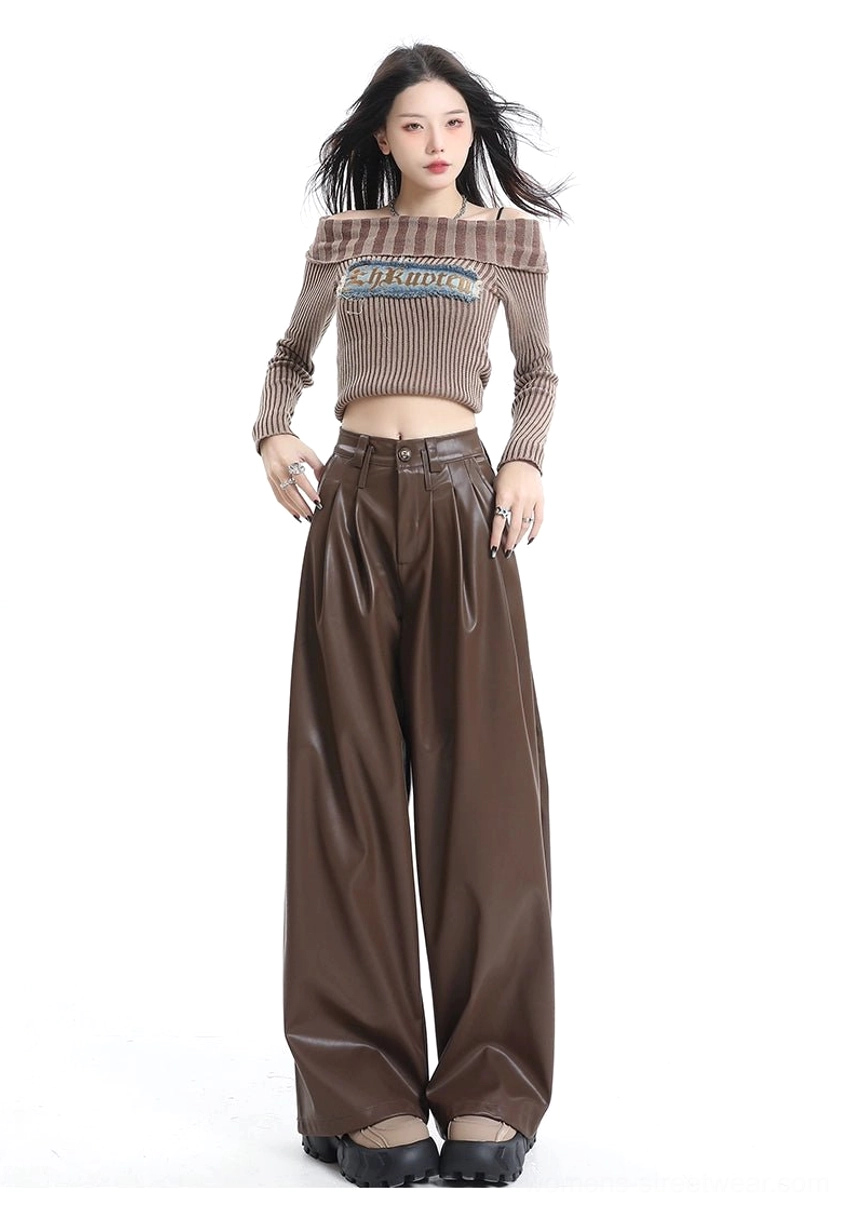 Coffee brown wide-leg faux leather pants shown with hands on hips highlighting the waistband belt loops pleats and glossy finish