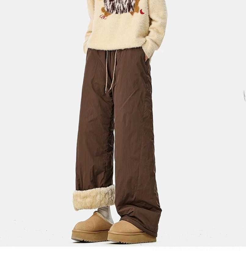 Cold-weather wide-leg streetwear trousers designed for thermal layering, snow boots, and casual urban outfits