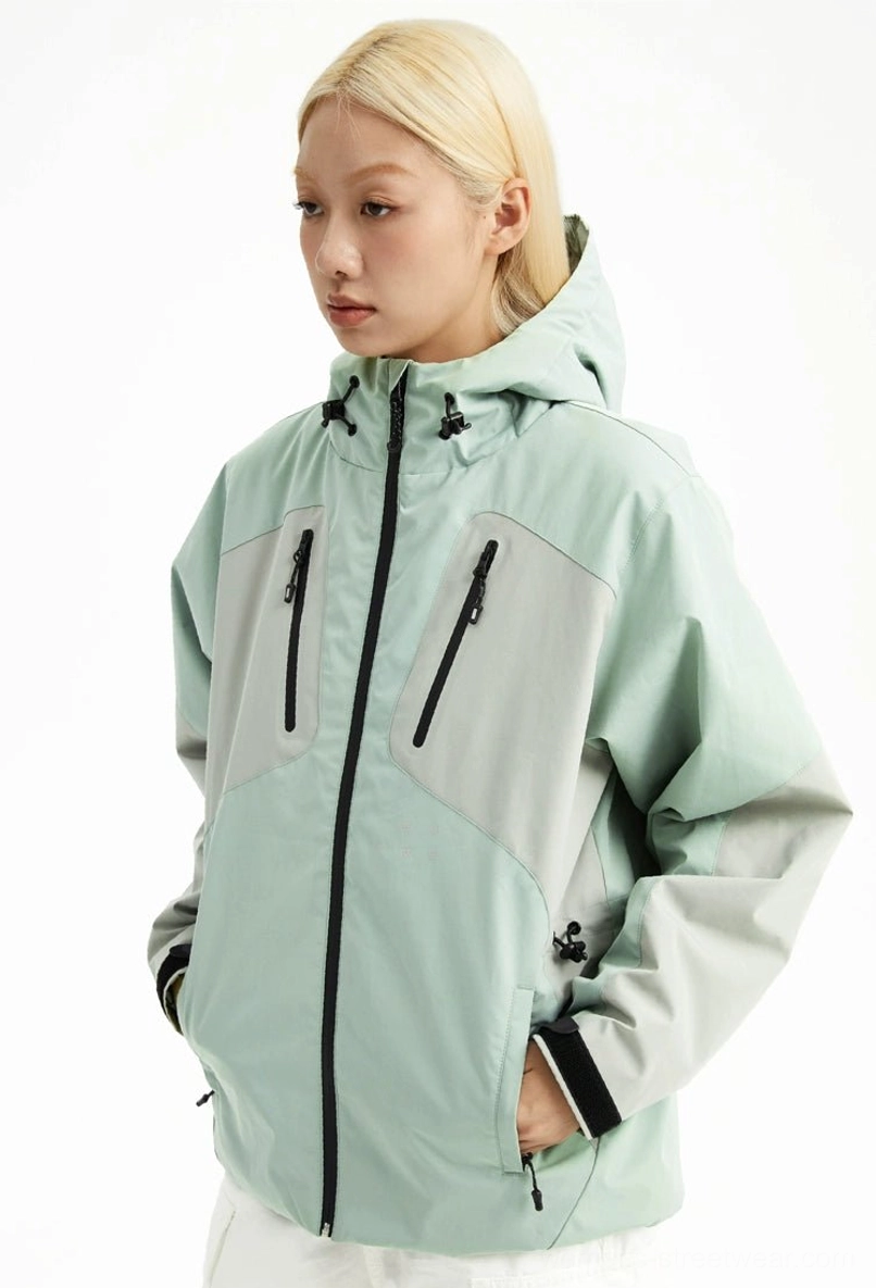 Mint green and light grey color block outdoor padded hooded jacket shown from a three-quarter front view with chest zip pockets and adjustable hood cords
