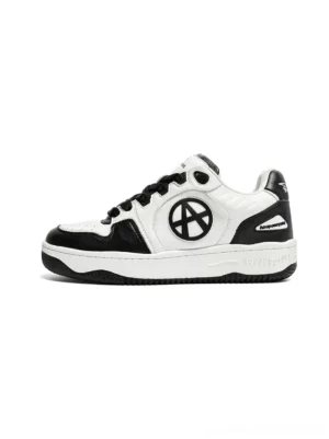 Circle logo colorblock black and white low-top skate sneakers left side view showing oversized branded logo on lateral panel