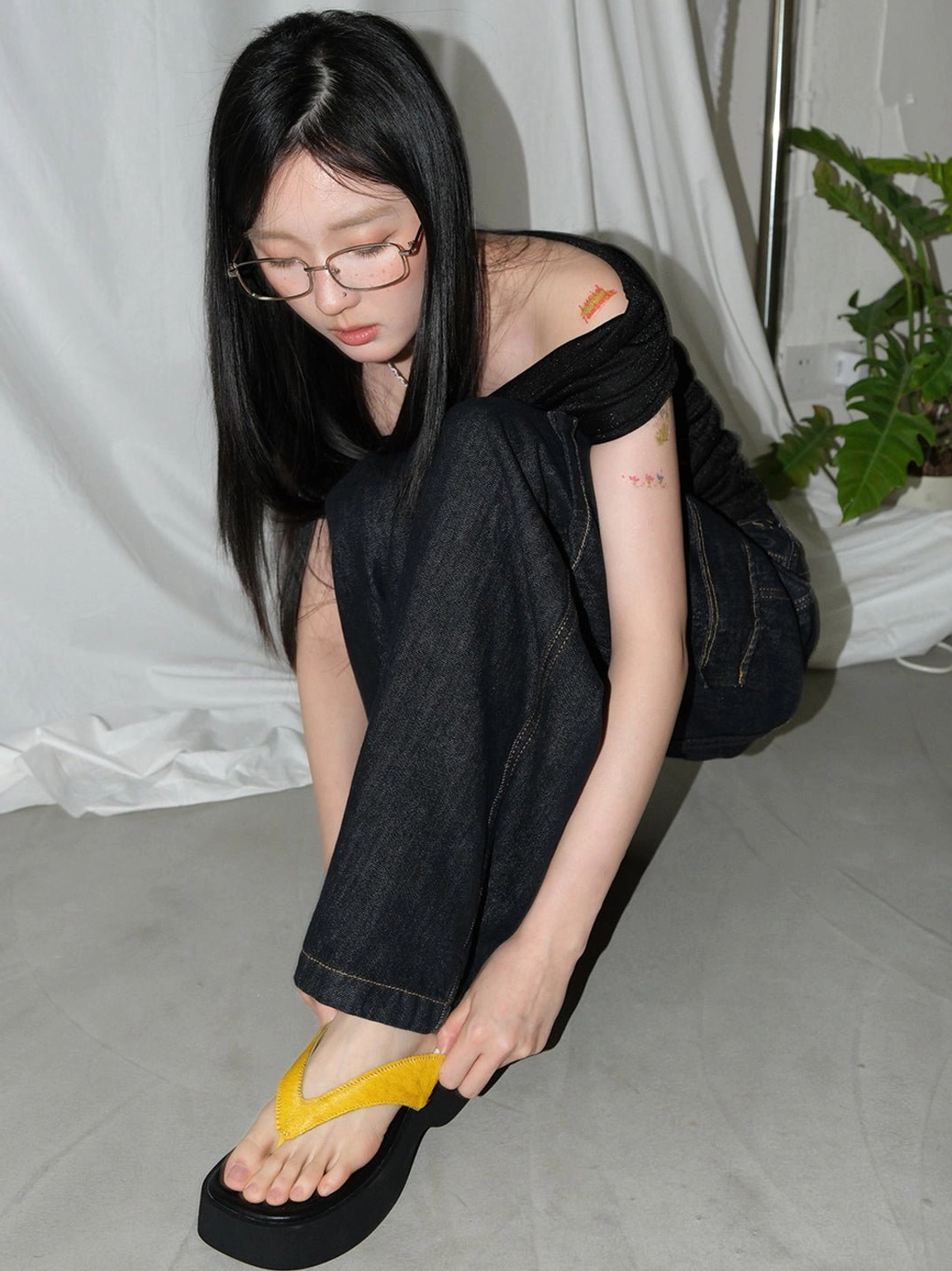 Colorful platform flip-flops with sculptural sole and statement toe strap for summer outfits