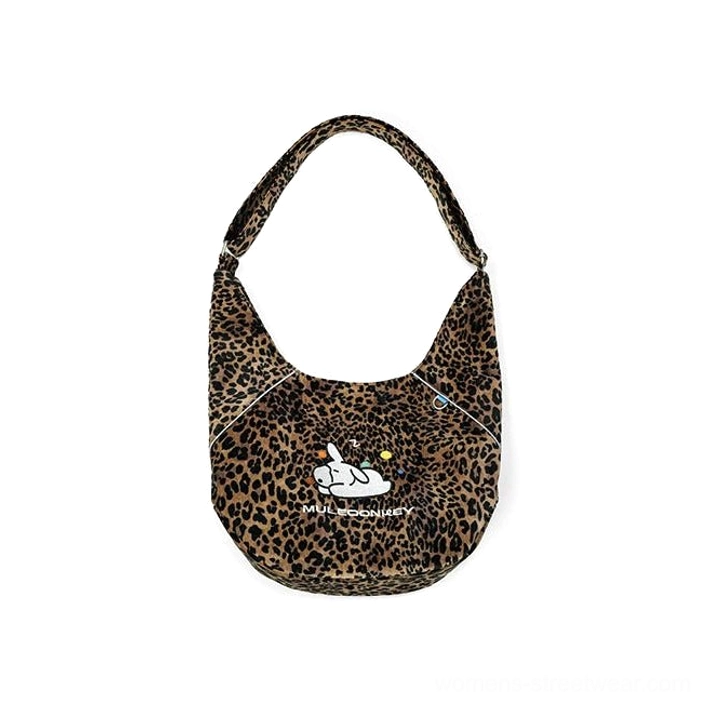 Compact leopard print bunny hobo shoulder bag with crescent shape embroidered bunny detail and adjustable strap