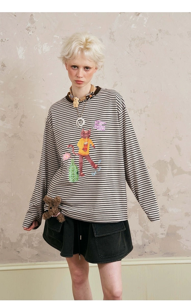 Full outfit styling combination - graphic sweatshirt with ruffle skirt matched accessories and footwear