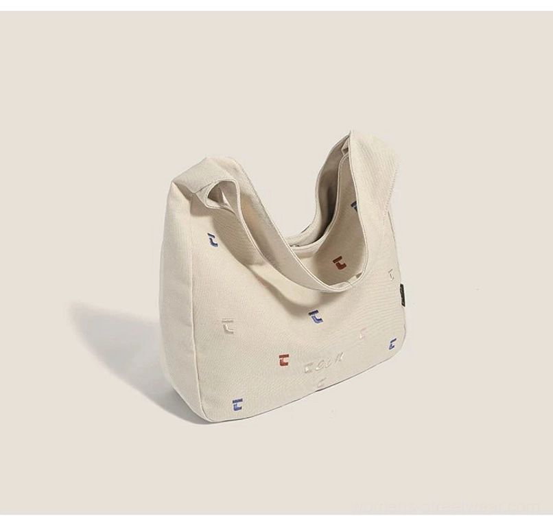 Khaki confetti stitched canvas hobo bag shown from the back with a wide single shoulder strap