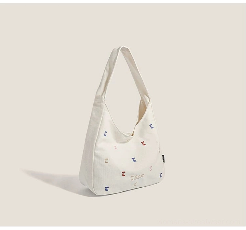 Off white confetti embroidered canvas hobo shoulder bag for Korean streetwear styling