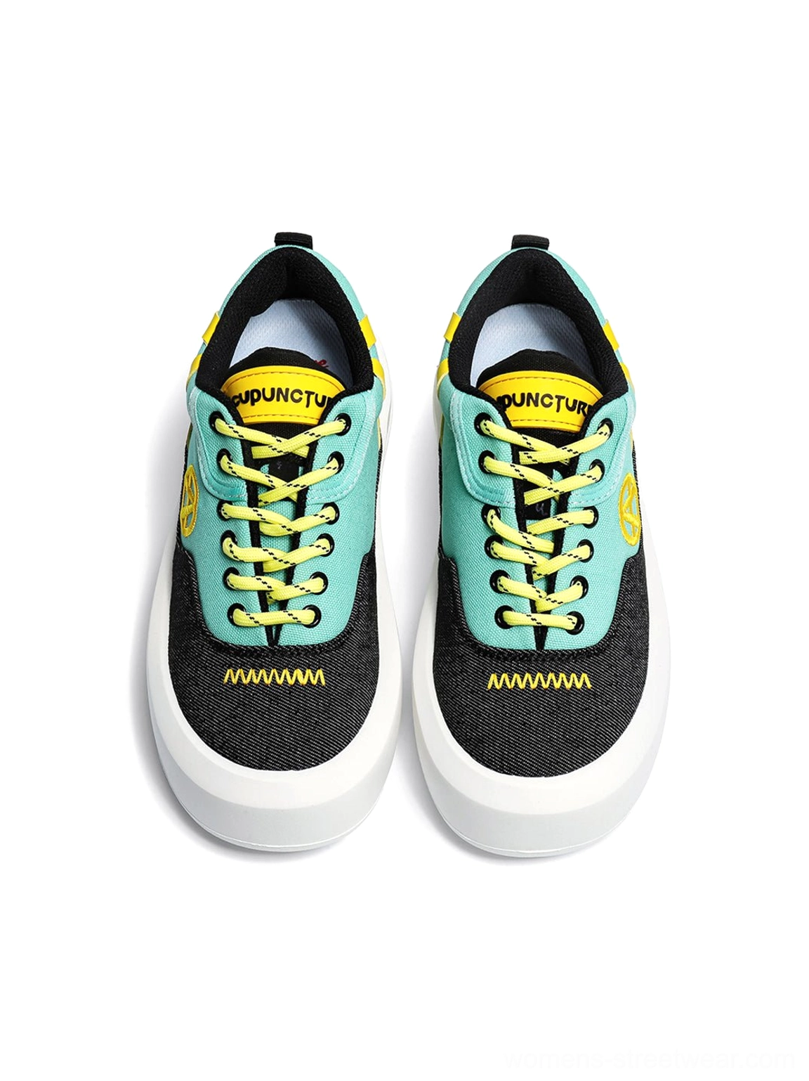Contemporary colorful canvas sneakers with graphic side detail chunky sole and expressive alternative fashion appeal