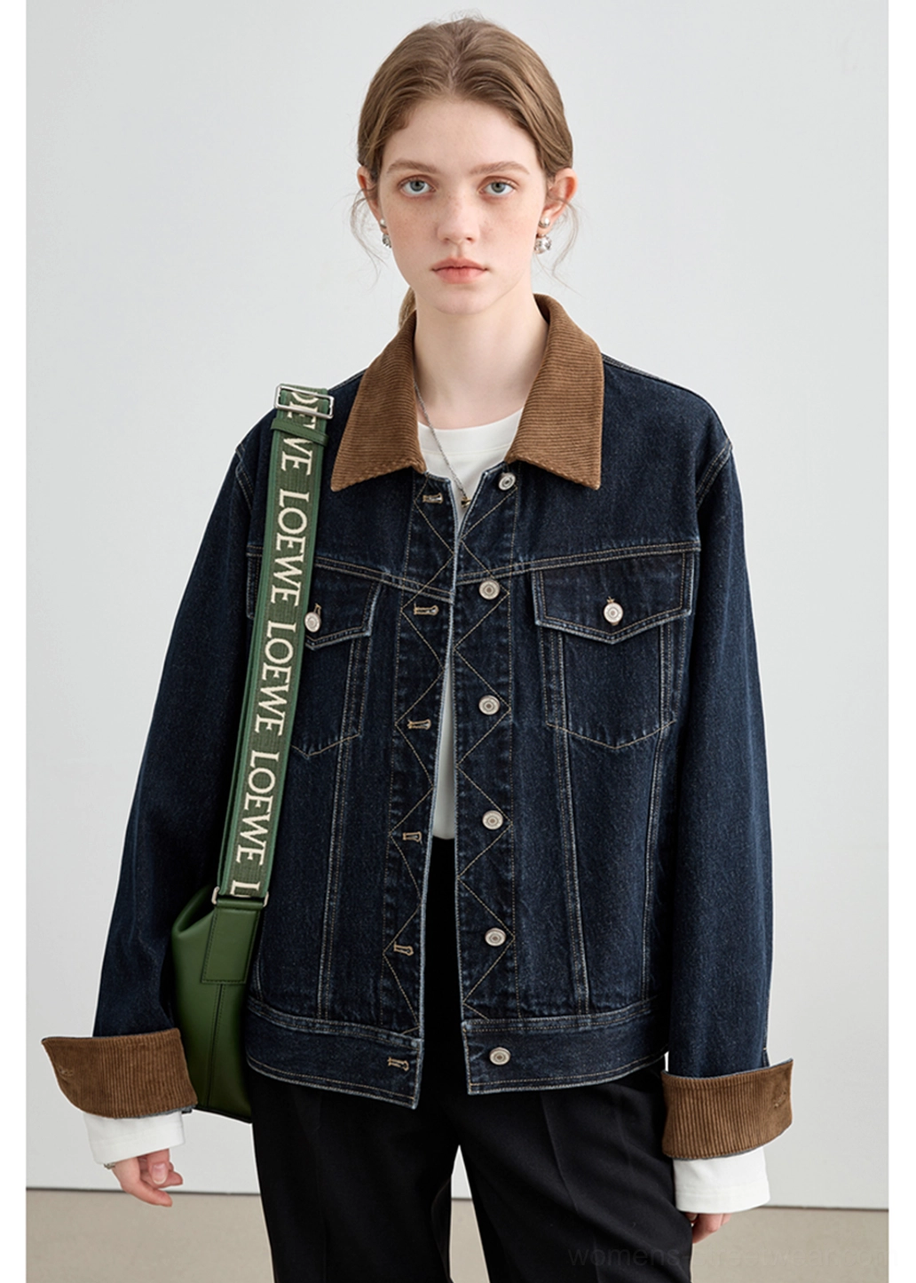 Contemporary denim outerwear jacket with chest patch pockets, metal button closure, and textured corduroy details