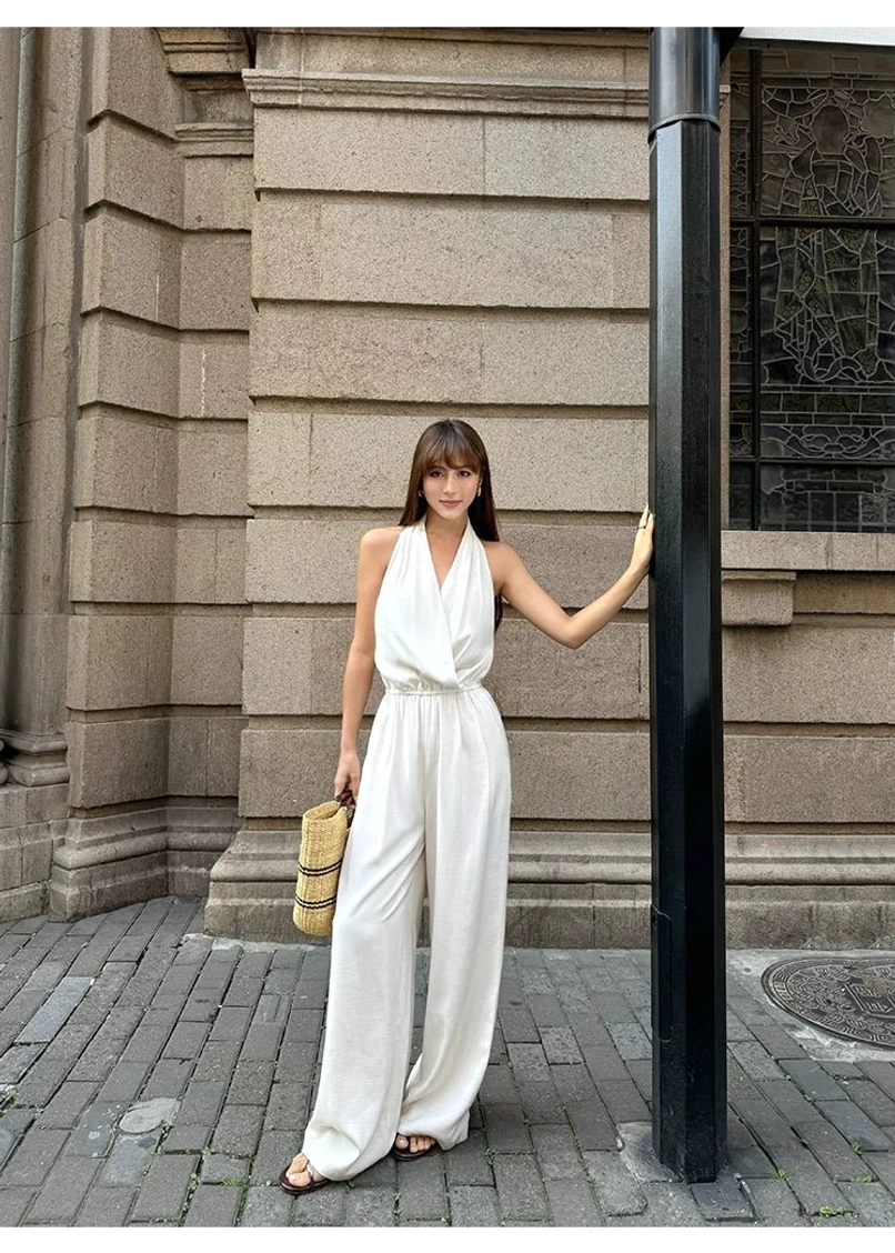 Contemporary halter wide-leg jumpsuit designed with an elongated silhouette and relaxed Korean fashion influence