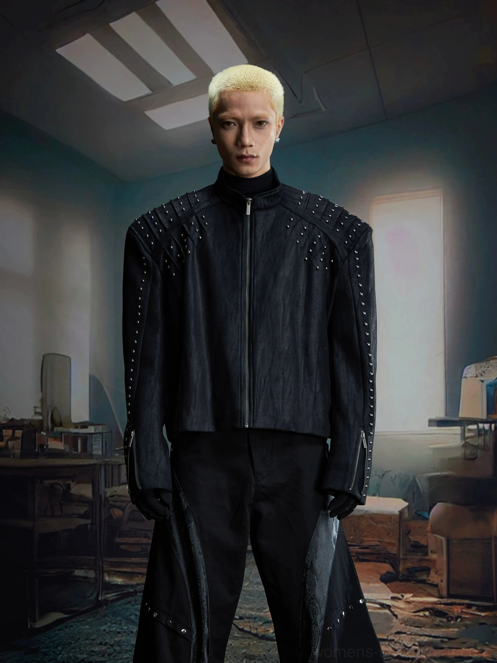 Contemporary studded moto jacket in faux leather with boxy cropped fit and adjustable zip cuffs
