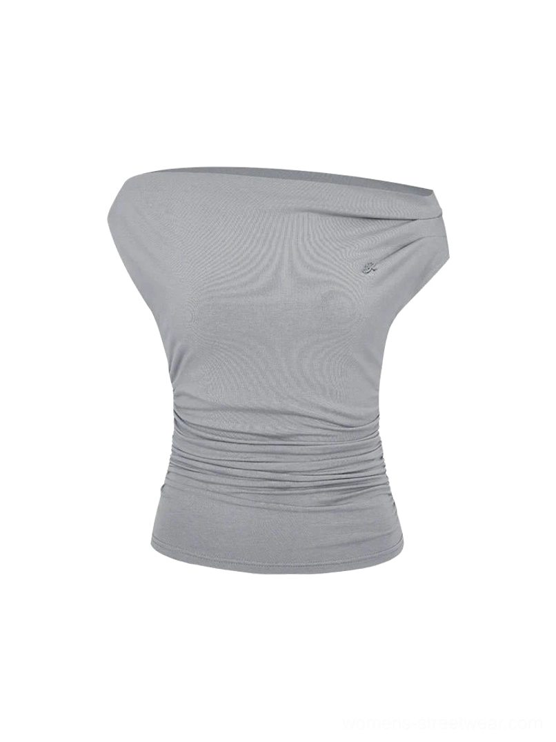 Contemporary women's asymmetrical off-shoulder ruched top suitable for Korean streetwear, casual looks, and nights out