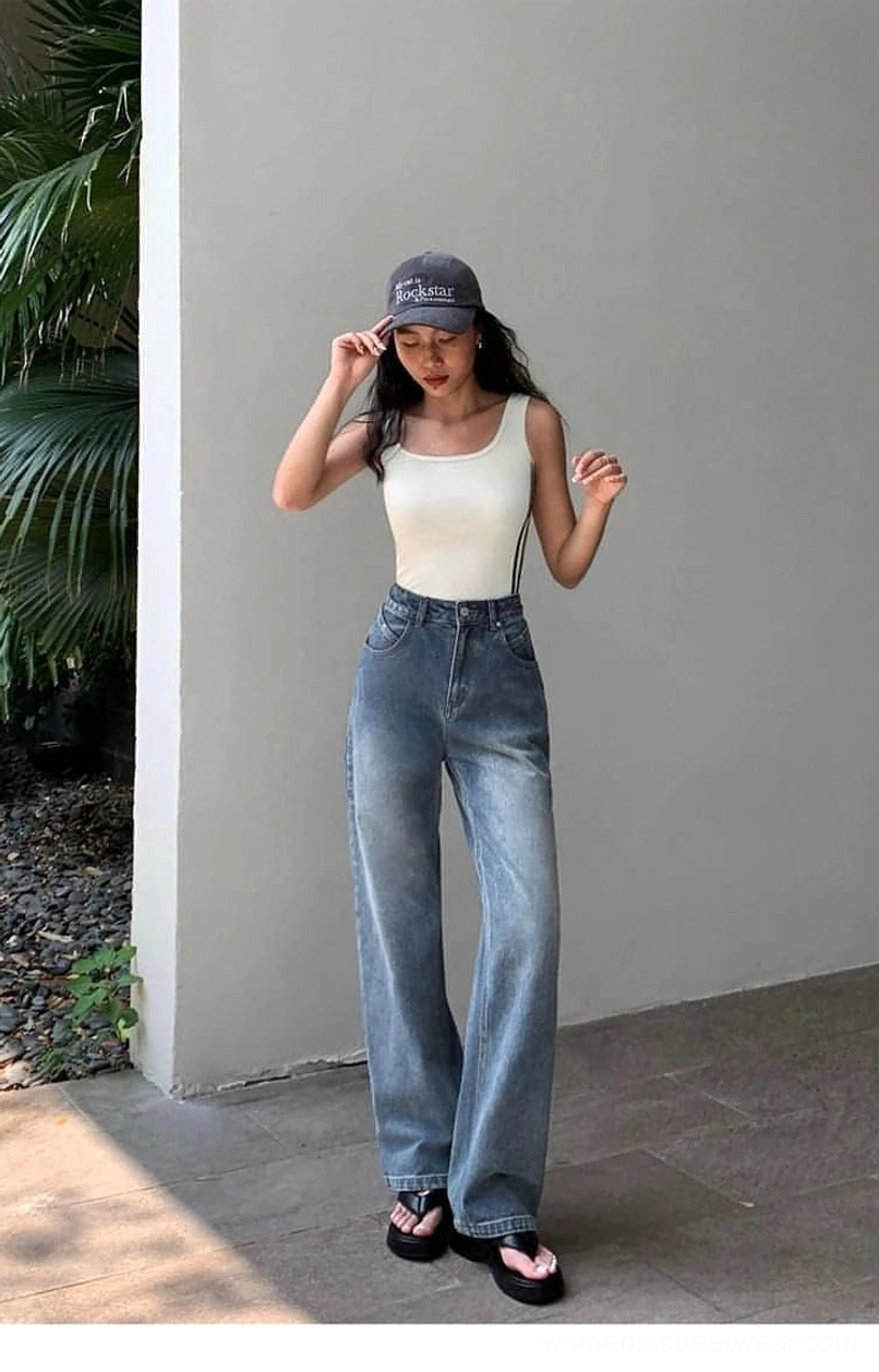Contemporary women's blue wide-leg jeans with high-rise waist and comfortable everyday streetwear fit