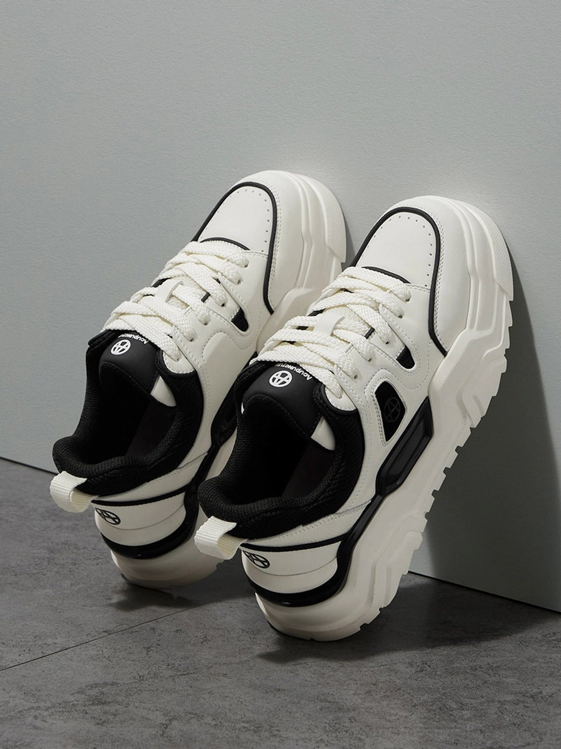 Angled rear view of contrast cutout platform sneakers showing heel details and black lining
