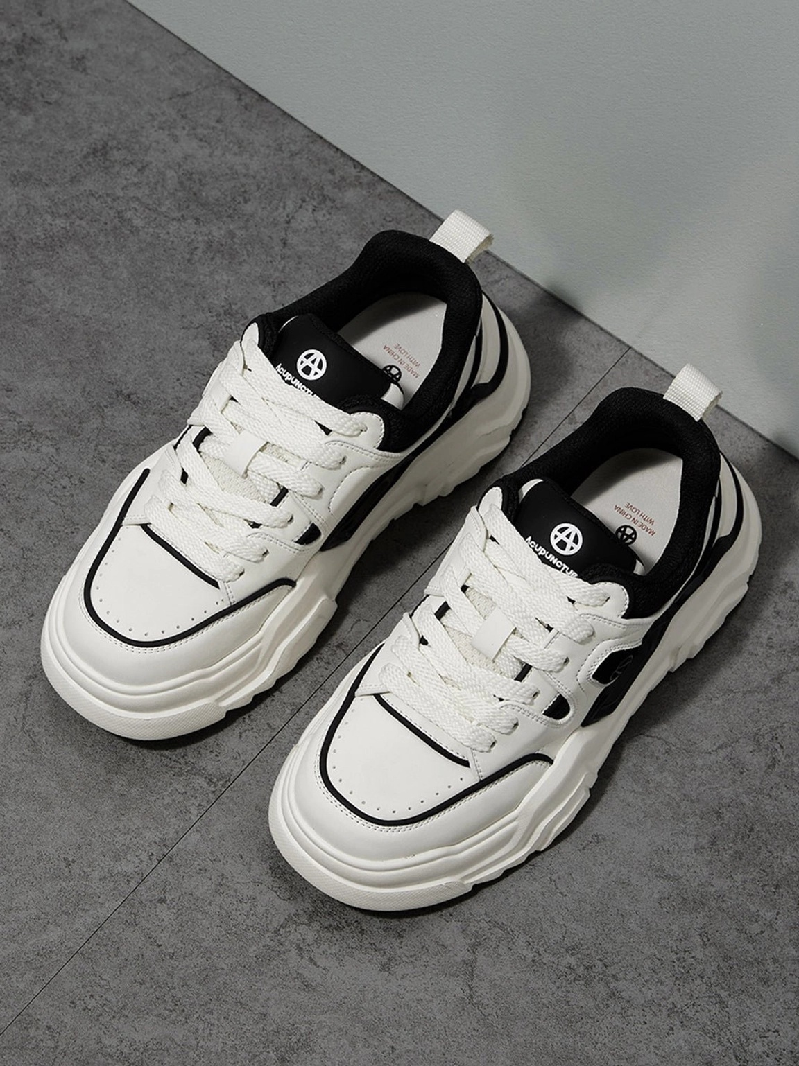 Angled top view of contrast cutout platform sneakers showing laces heel tabs and padded collars