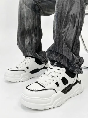 Contrast cutout platform sneakers styled with dark baggy denim in a streetwear outfit