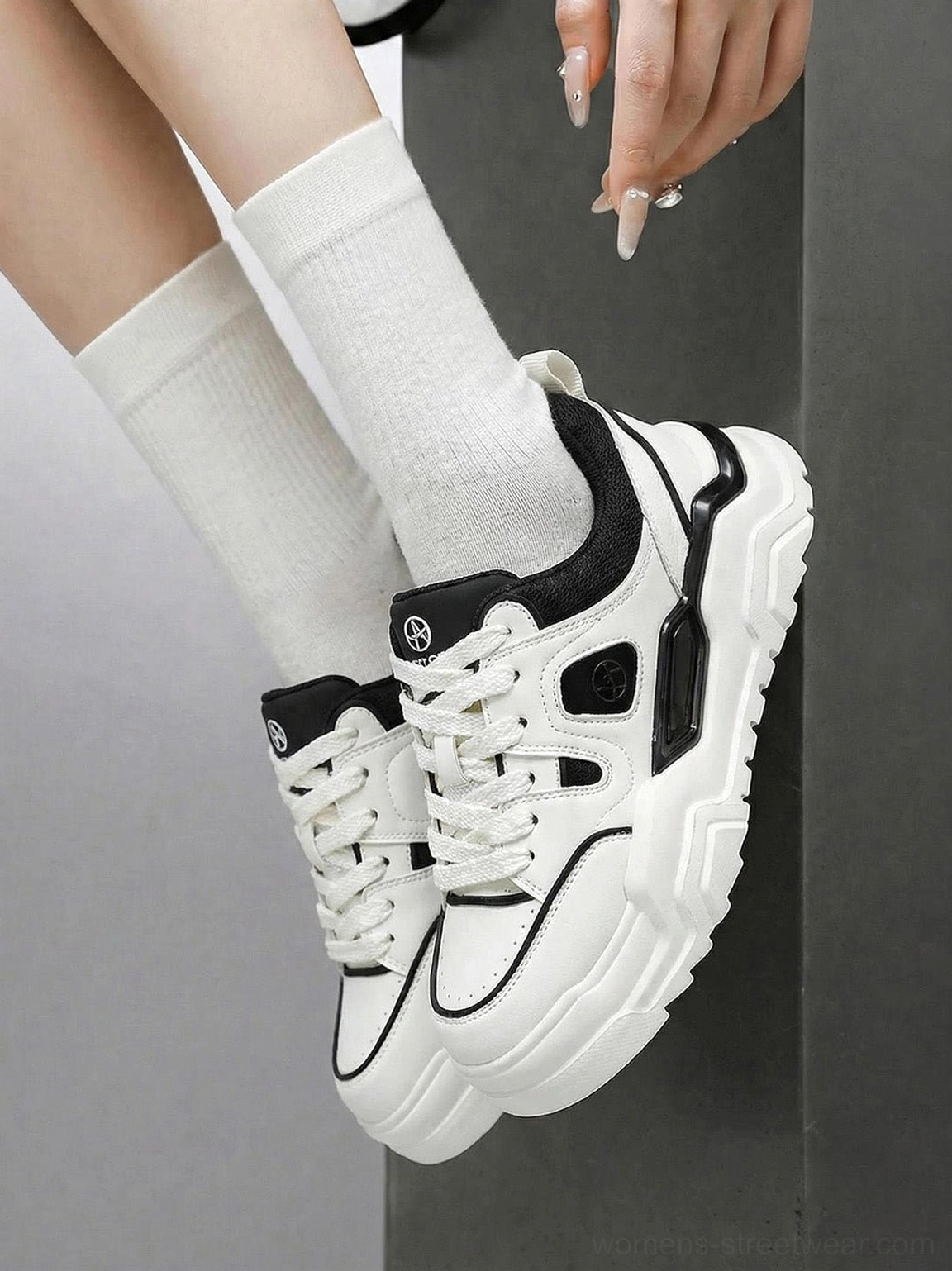 Close-up of contrast cutout platform sneakers with raised lug sole and white crew socks