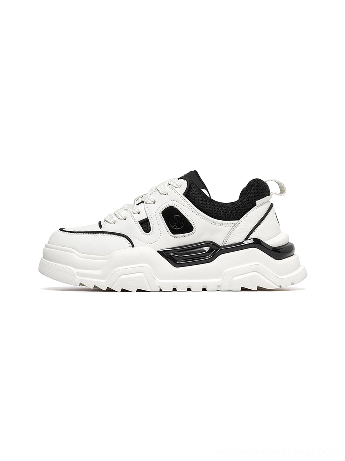 White and black contrast cutout lug sole platform sneakers shown in side profile