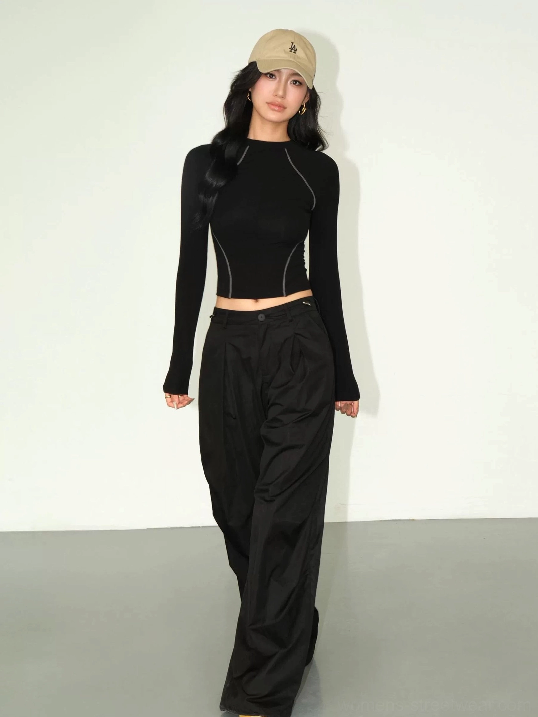 Black contrast stitch cropped tee full body front view with wide leg black cargo pants khaki cap Y2K style