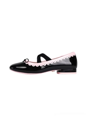 Black patent finish Mary Jane ballet flats with pink scalloped contrast trim, tiny toe bows, and low rubber heels