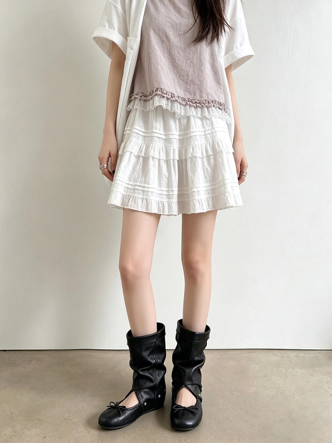 Convertible slouchy sandal boots close-up featuring layered wrap straps and gathered boot shaft