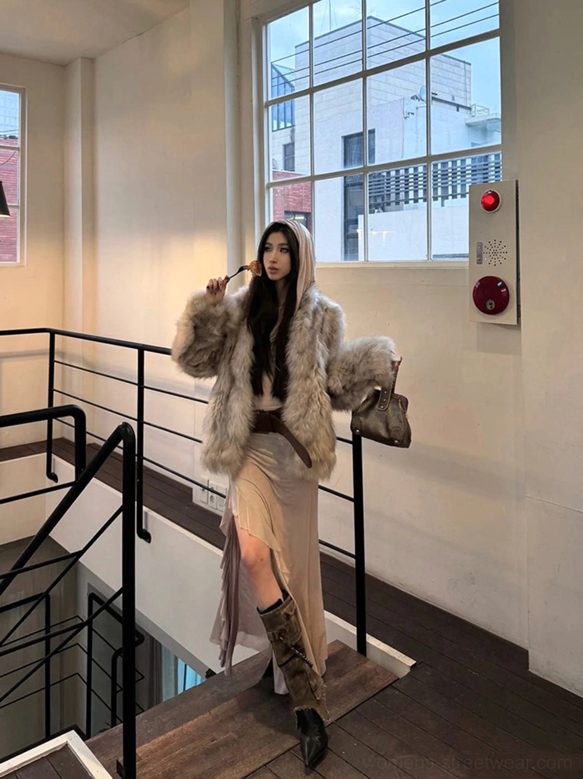 Distressed detachable shaft stiletto boots styled with a faux fur coat and split midi skirt