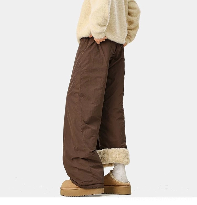 Convertible fleece-lined pants with casual wide-leg volume, adjustable waist, and contemporary urban winter appeal