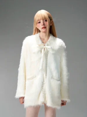 Ivory shaggy faux fur bow cardigan jacket front full body view with satin ribbon collar and trimmed patch pockets