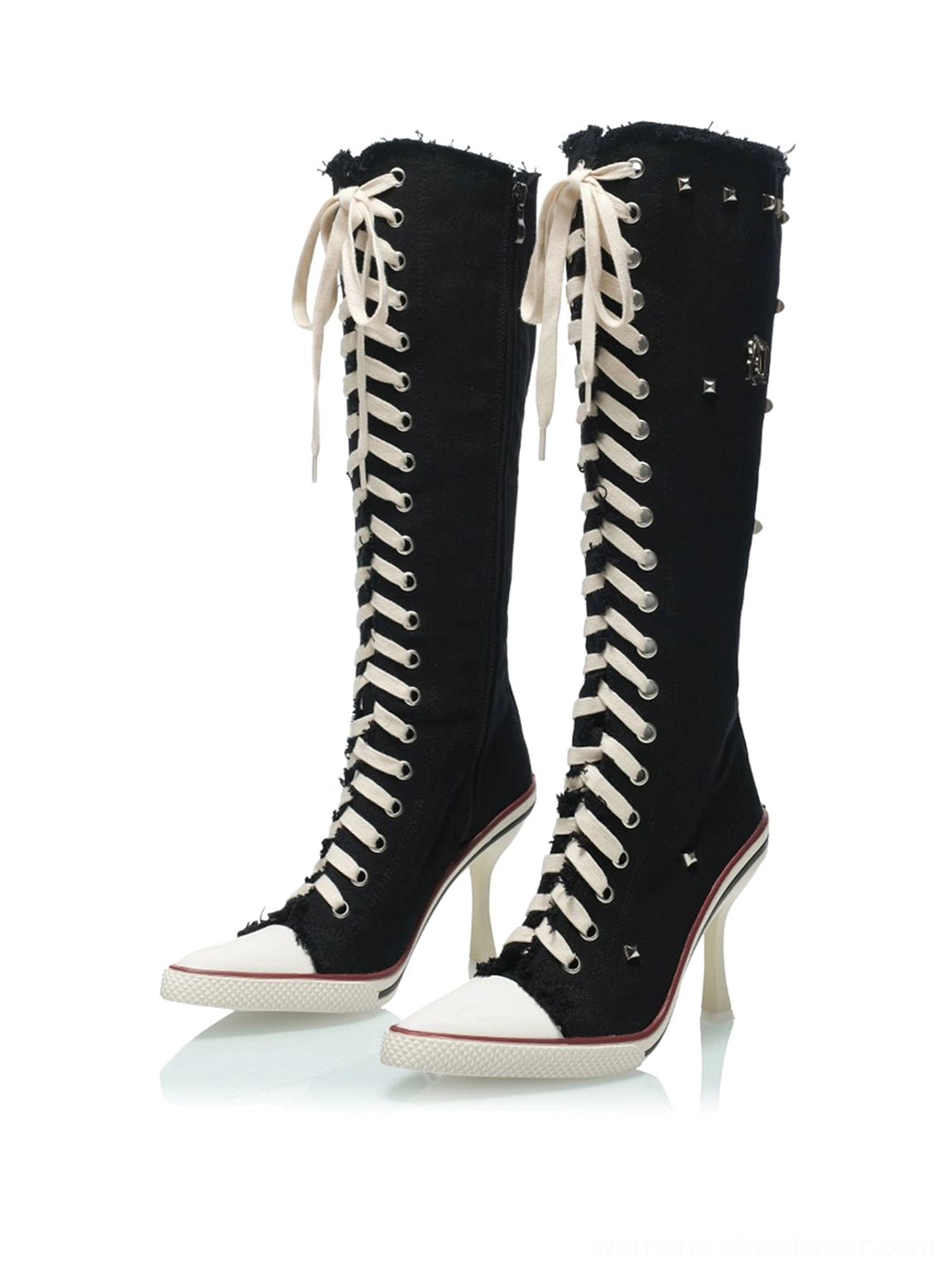 Pair of black corset lace-up knee-high stiletto boots with pointed contrast toe caps shown in front flat lay view