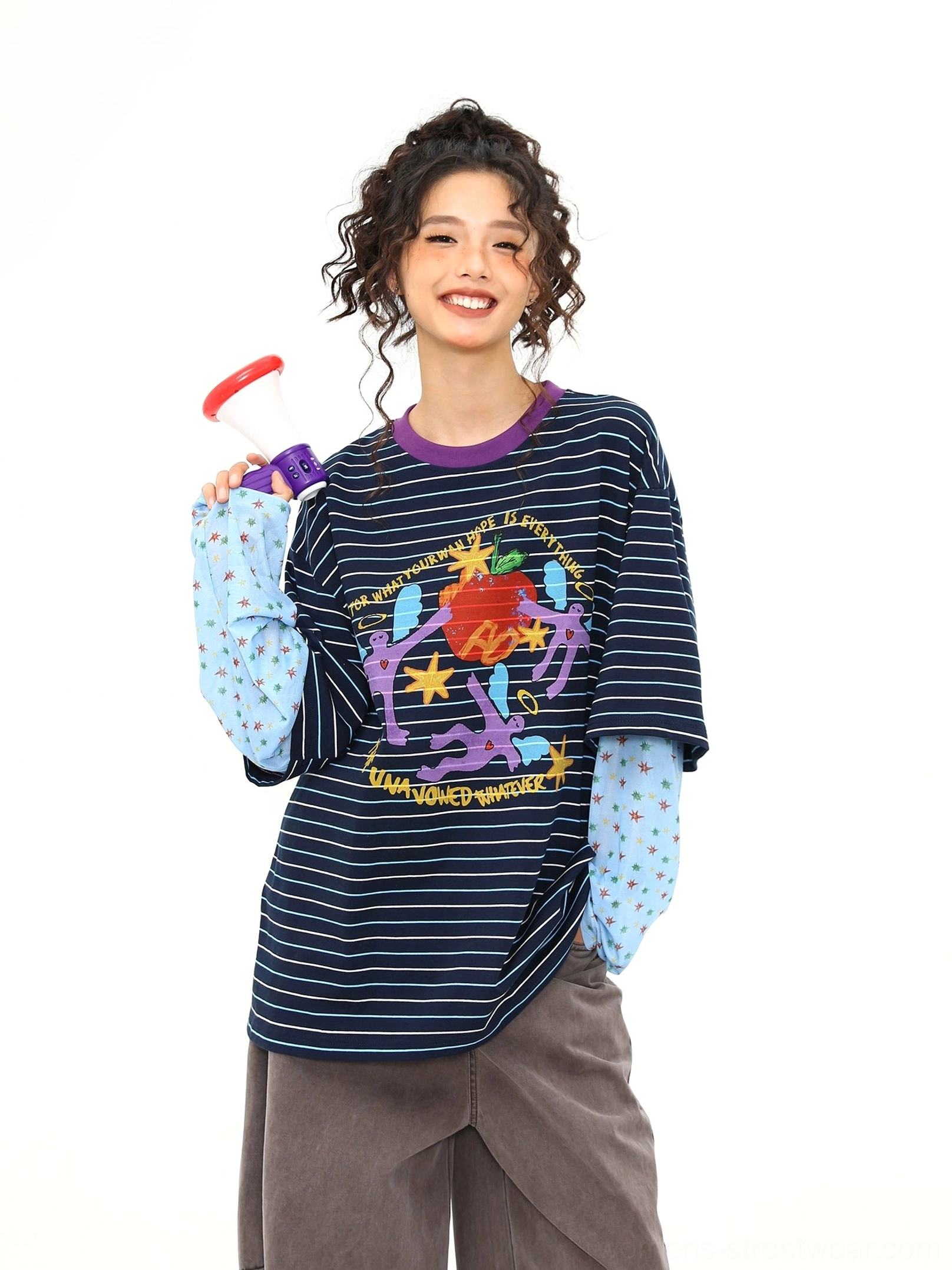 Blue striped fake two-piece long sleeve streetwear tee with colorful cartoon graffiti graphic, contrasting purple collar, polka dot inner sleeves, and oversized relaxed fit