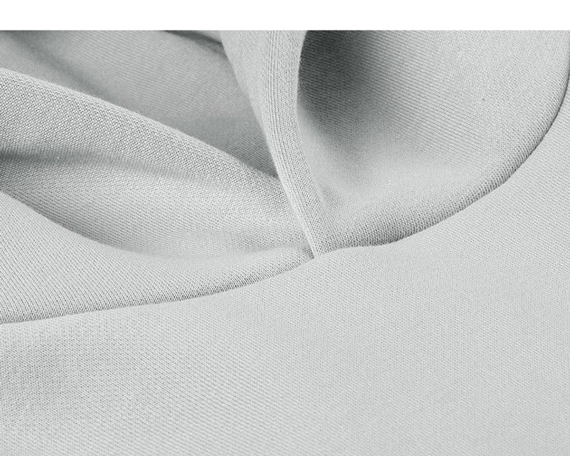 Macro view of soft cotton blend hoodie fabric with fine French terry texture for an oversized streetwear pullover