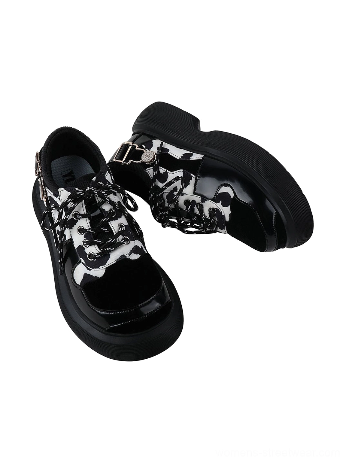 Chunky cow print platform shoes for women with Mary Jane buckle styling, black lace-up front, and alternative Y2K streetwear appeal