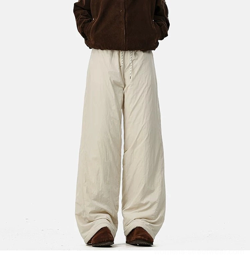 Cozy convertible streetwear pants featuring a wide-leg silhouette, drawstring waist, and insulated fleece lining