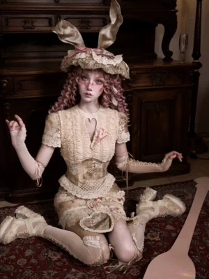 Cream beige vintage lace patchwork corset top with heart neckline cutout, ruched waist, and delicate scalloped trim shown in a seated outfit view