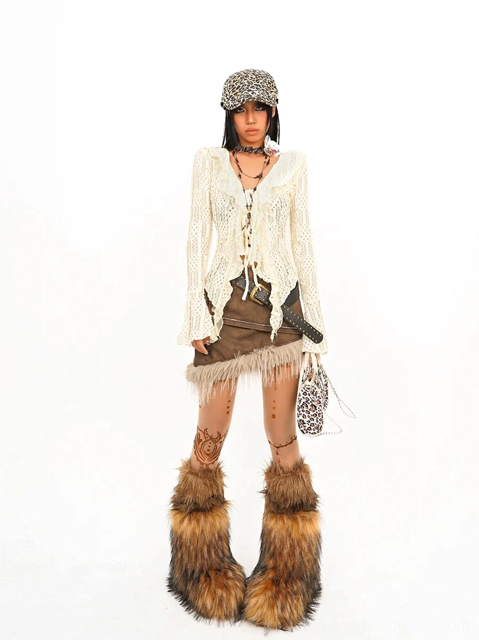 Full-body front view of women cream boho crochet tie-front top styled with mini skirt, layered jewelry, and Y2K accessories