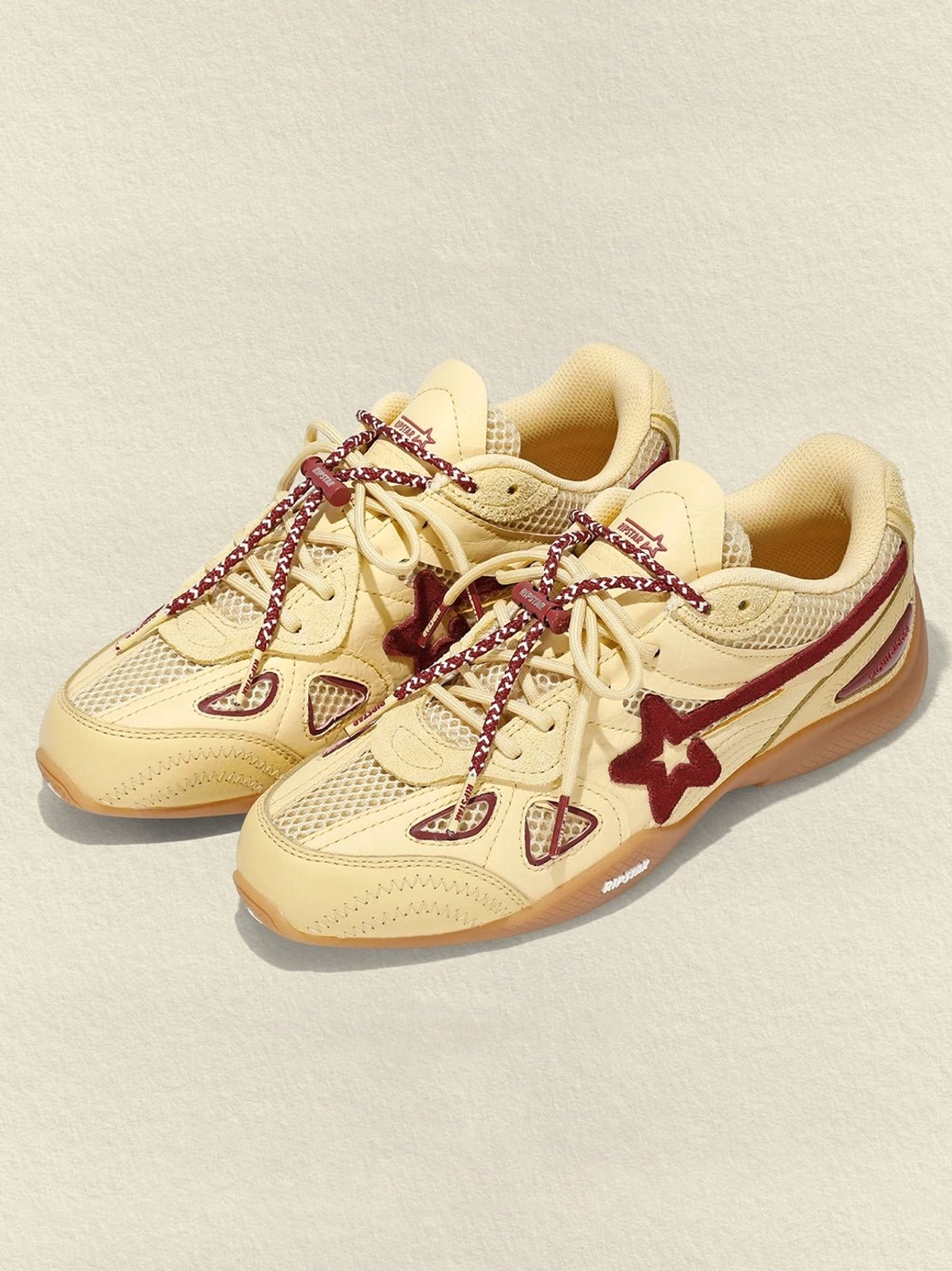 Cream burgundy star retro running sneakers mixed-material upper and low-top streetwear silhouette detail