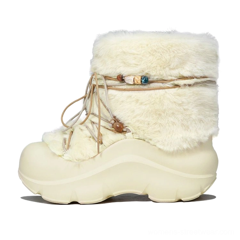 Cream faux fur snow boot shown from a front three-quarter angle with fluffy collar, beaded drawstring, and thick platform outsole