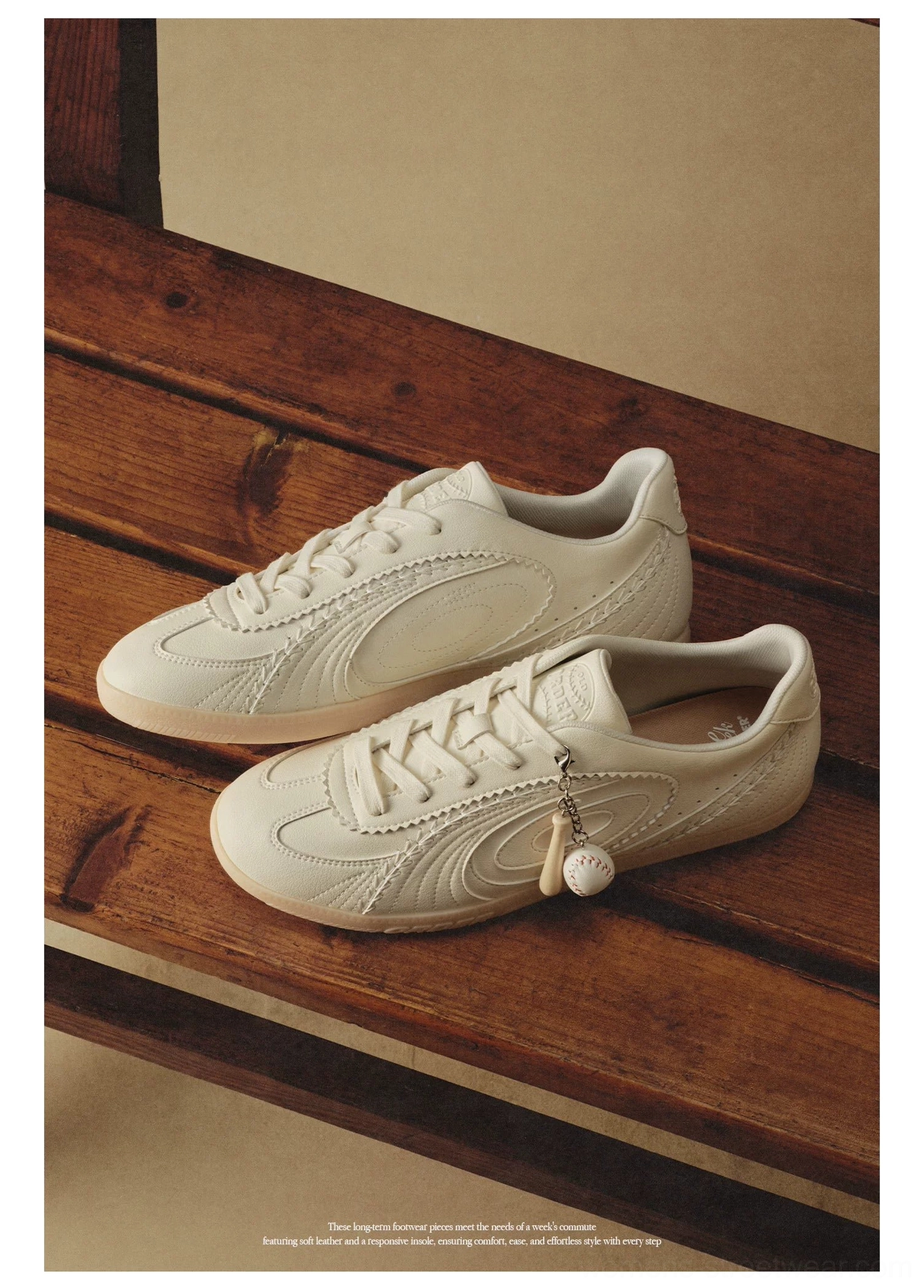 Cream low-top retro training sneakers with layered mesh panels delicate stitching and gum rubber sole