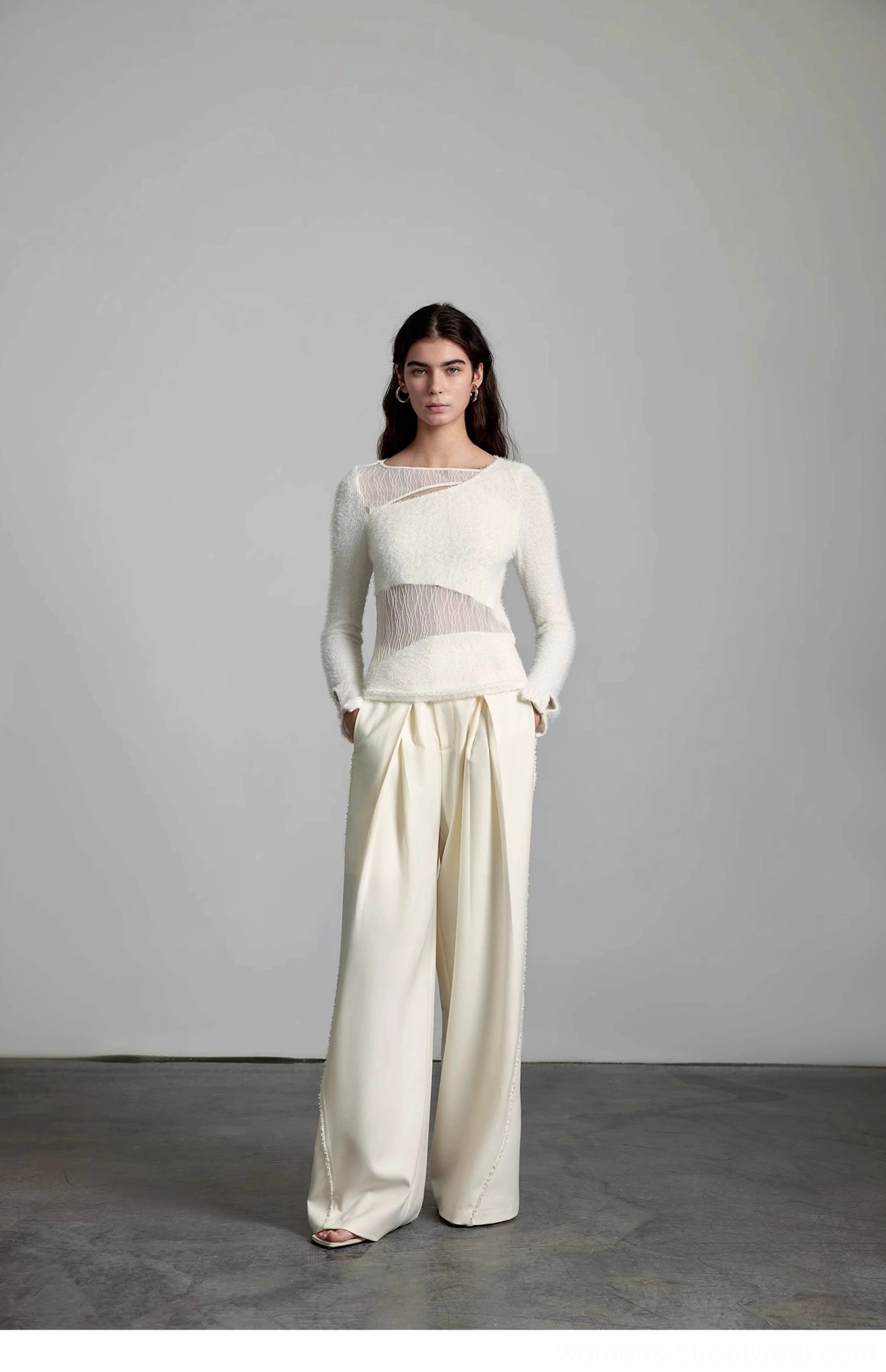 Cream pleated streetwear trousers with high waist and wide-leg silhouette for contemporary city styling