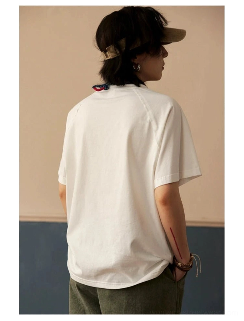 Cream white raglan crew neck t-shirt styled with elevated casual accessories for minimalist streetwear aesthetic