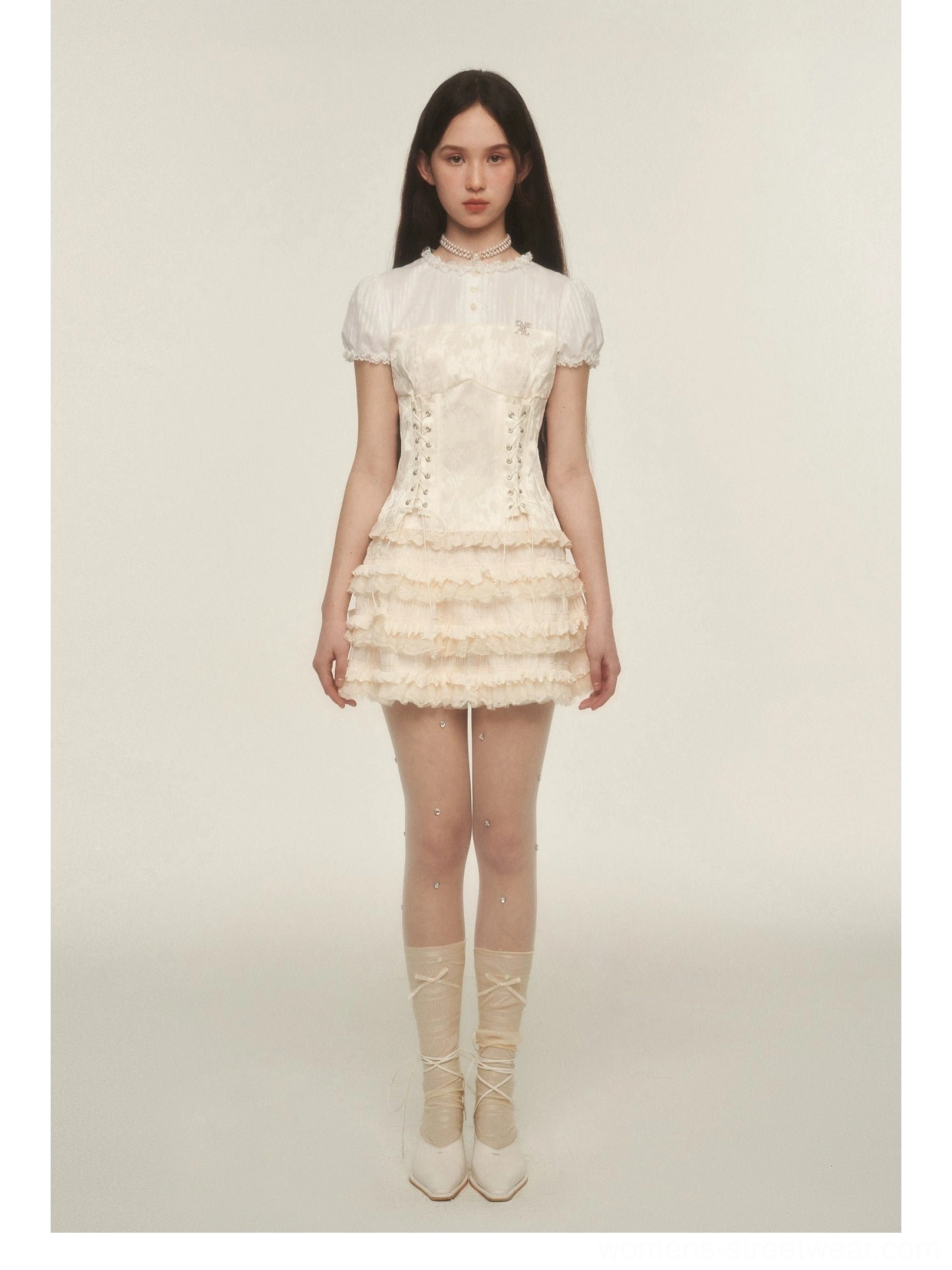 Full length cream tiered ruffle mini skirt outfit with lace-up socks white flats and sheer rhinestone tights