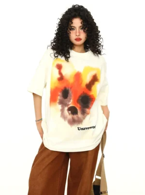 Cream oversized fox graphic cotton T-shirt with watercolor artwork styled with brown wide-leg pants