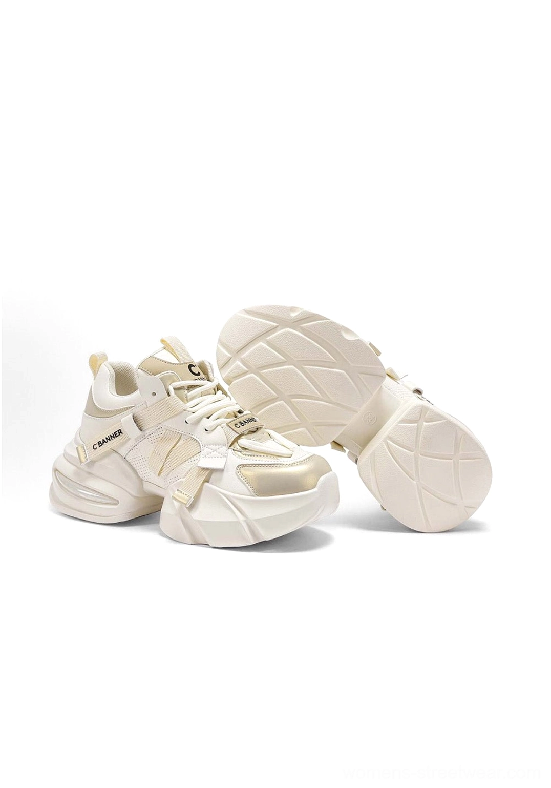 Cream white chunky dad sneakers with detailed stitched upper and geometric patterned rubber outsole