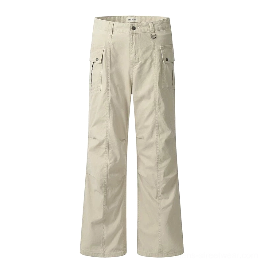 Flat lay view of cream white wide-leg cargo pants showing button zip fly, side pockets, rear pockets, and tailored seam details