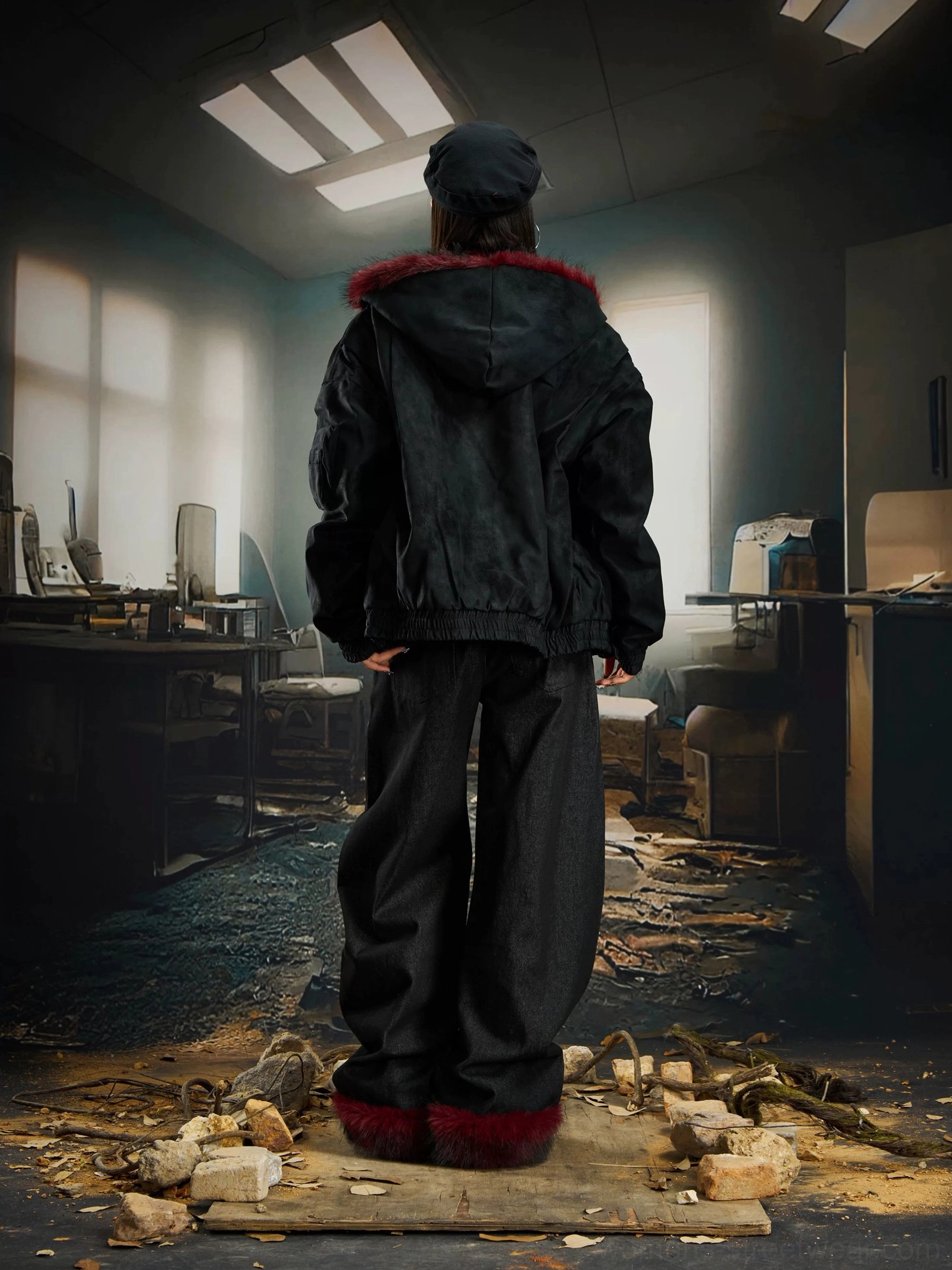 Back view of black oversized faux fur hood gothic bomber jacket showing relaxed gender neutral streetwear silhouette