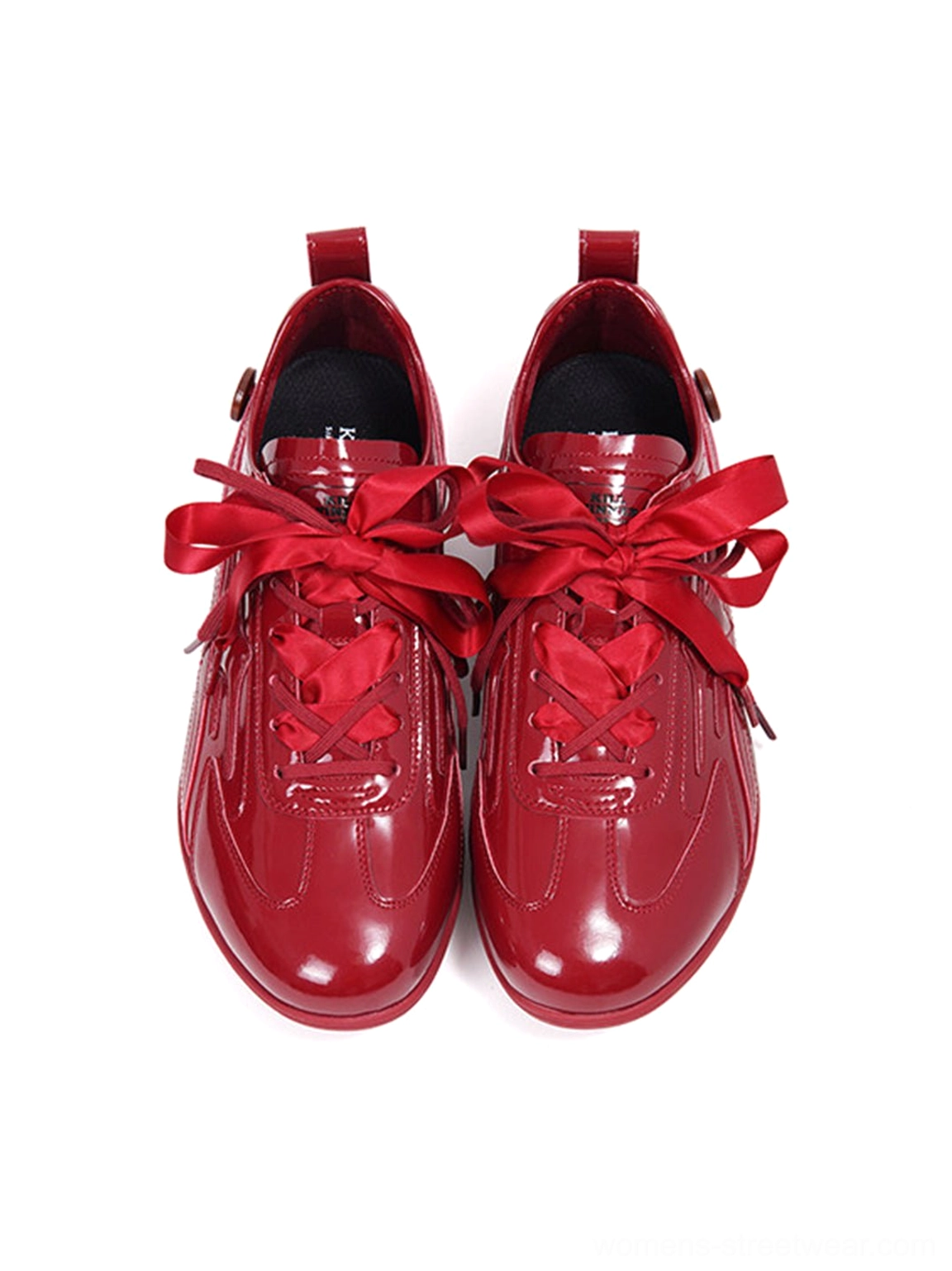 Front top view of paired crimson red gloss ribbon lace retro runner sneakers with rounded toe boxes