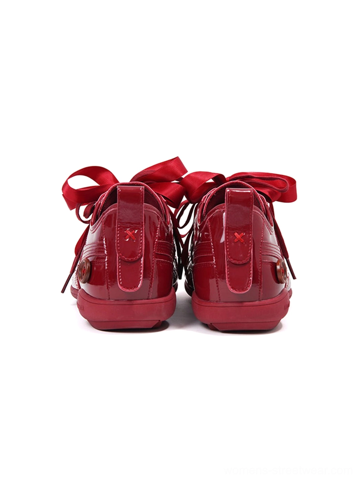 Top rear view of paired crimson gloss retro runner sneakers with heel pull details and tied ribbon laces