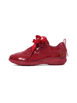 Crimson gloss ribbon lace retro runner sneakers in red shown in a left three-quarter studio view