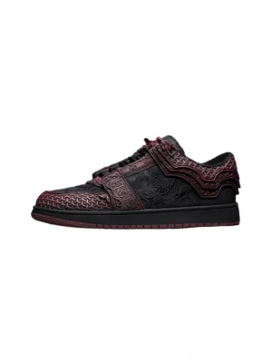 Crimson and black Jin Yi Wei inspired embossed low-top streetwear sneaker shown in a left side profile with wine red relief panels and dark rubber sole