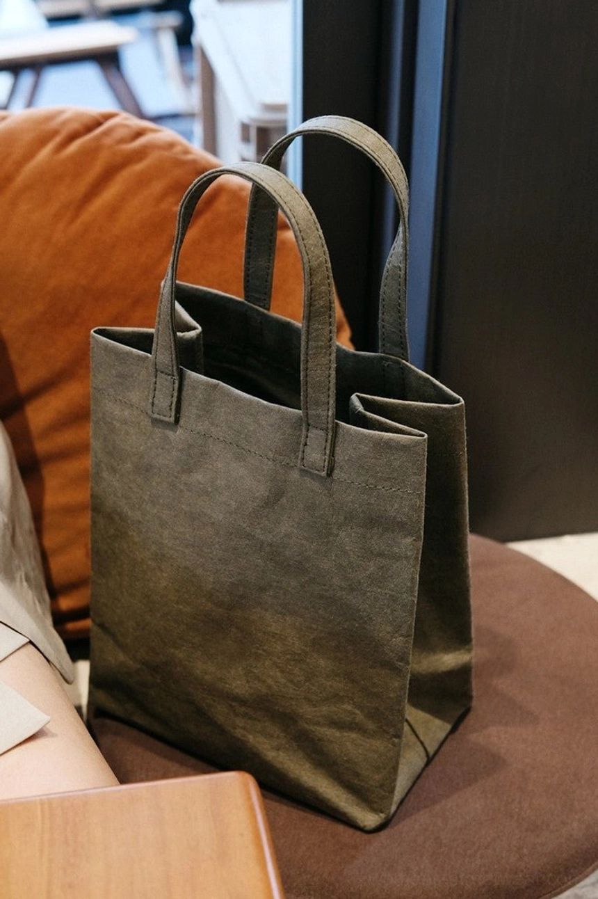 Army green crinkled kraft paper effect cotton tote bag with a soft rectangular silhouette and double top handles